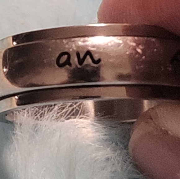 Ring, silver tone, reads "protected by an angel" in black, size 9 - Picture 3 of 7